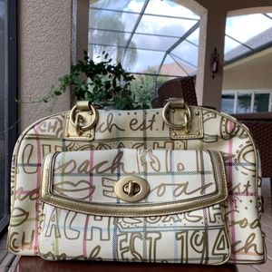 White and gold Coach purse